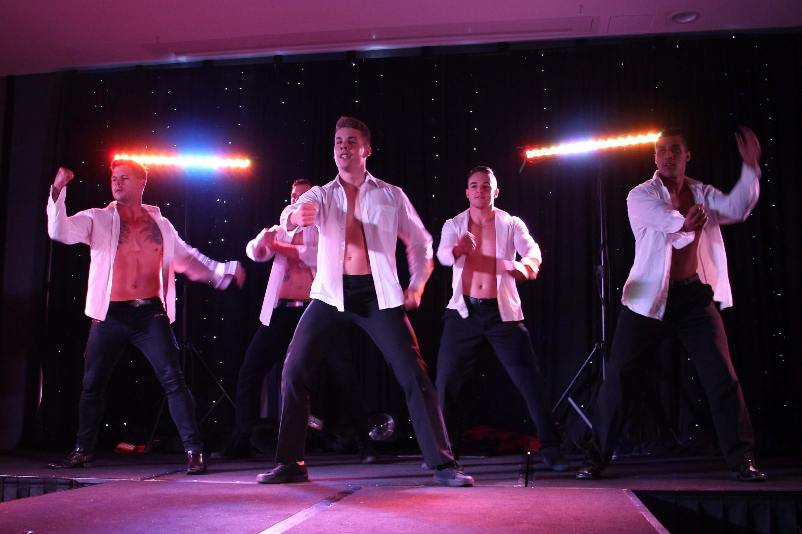 Sydney Hotshots male revue performing on stage